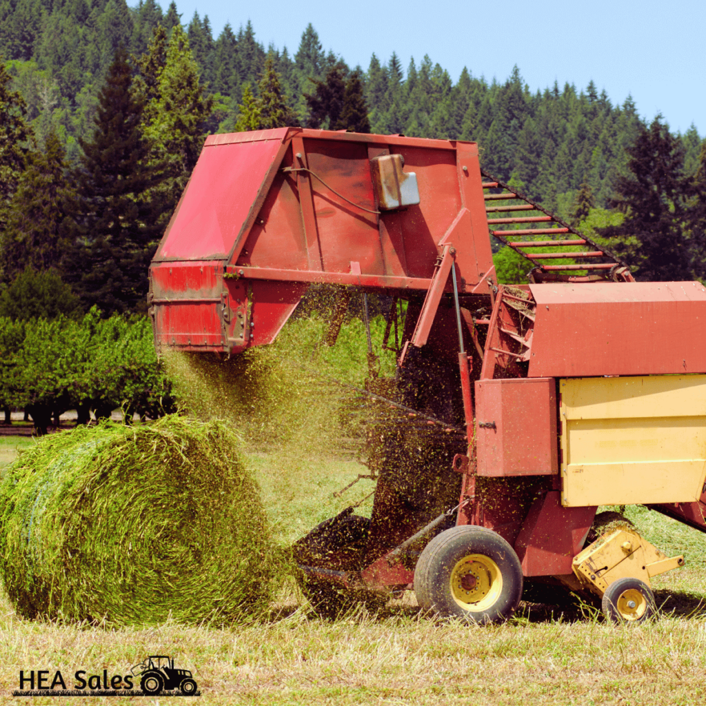 Tractor bailing hay.